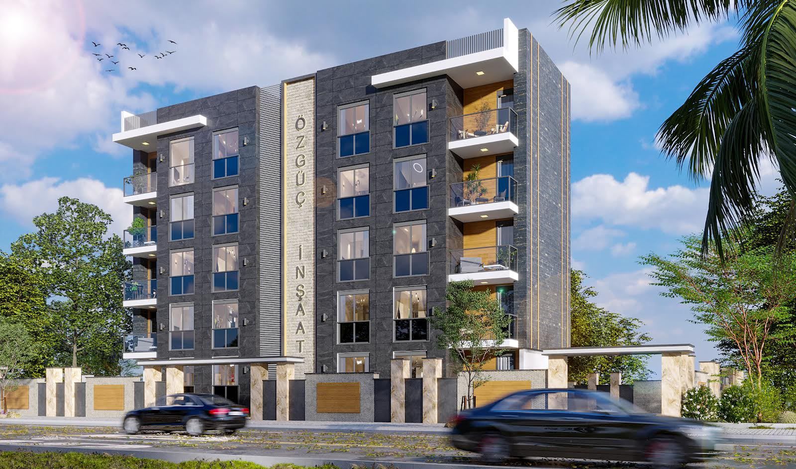 Özgüç İnşaat yazılı apartman cephesi
